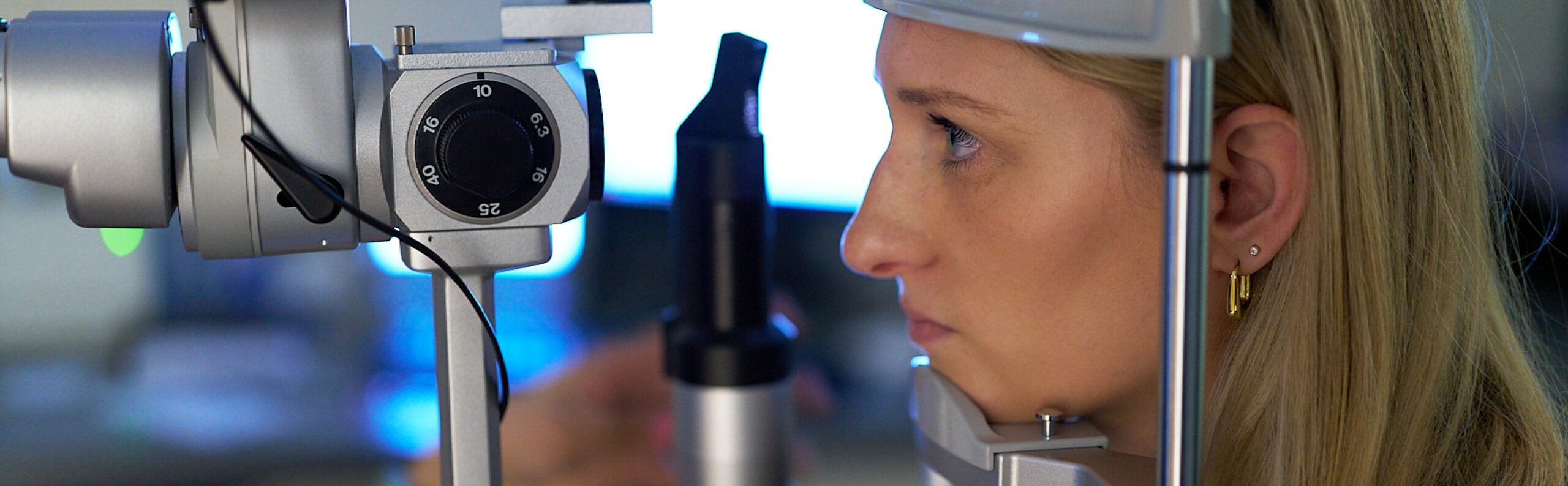 Female patient being examined by NECO student at NECO Center for Eye Care - Commonwealth