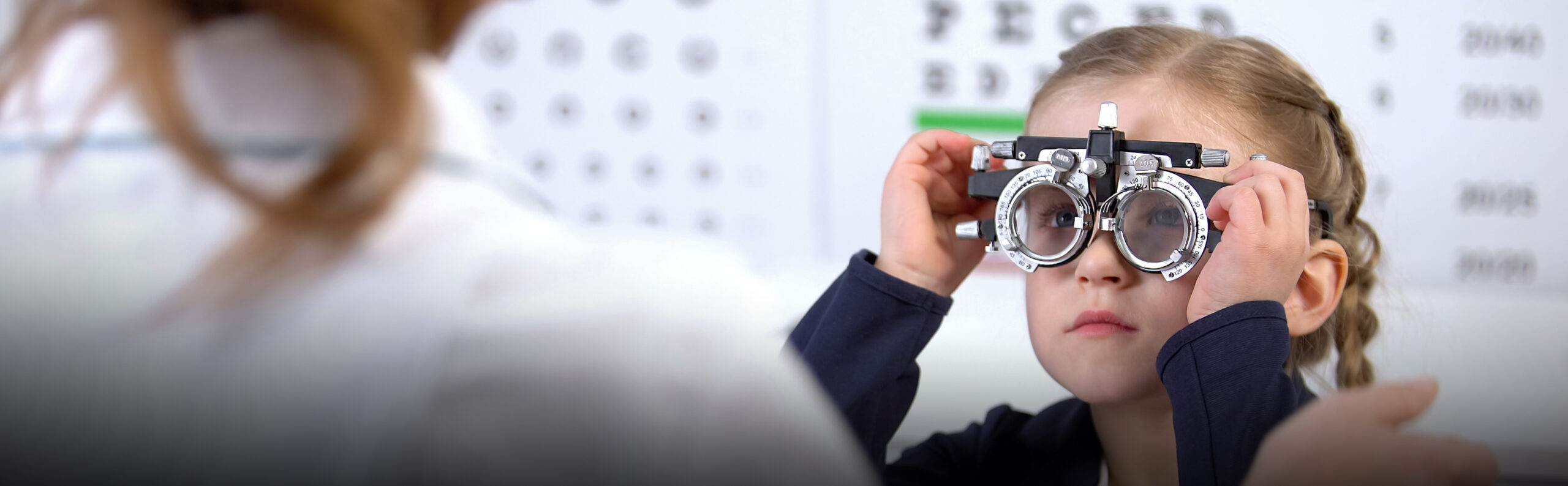 Stock image child being examined by optometrist