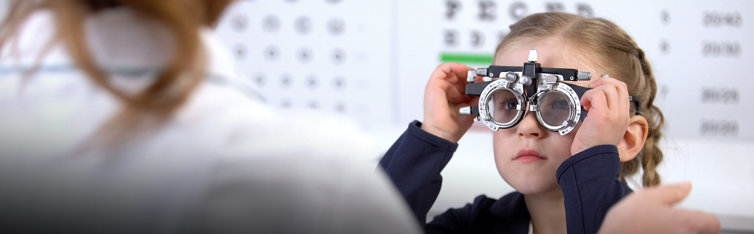 Stock image child being examined by optometrist