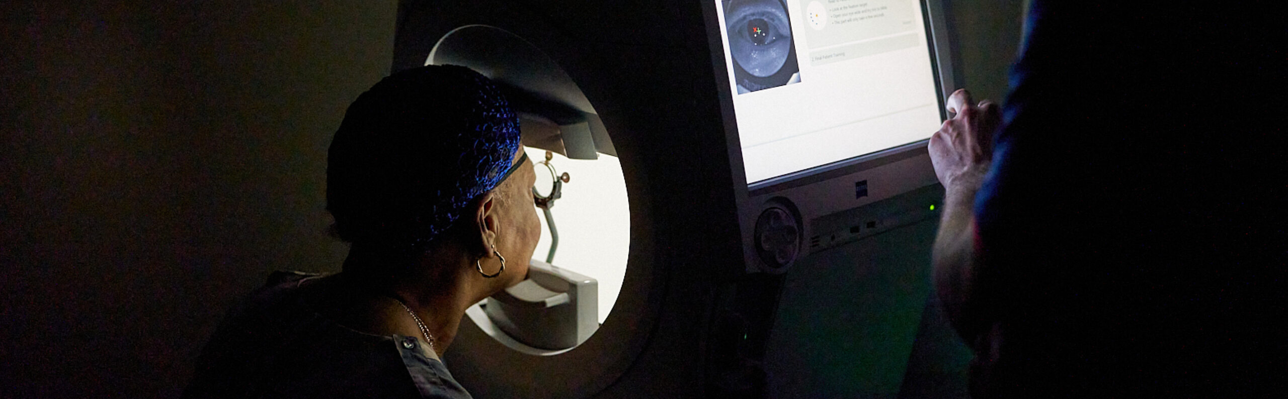 Elderly female patient being examined by NECO student at NECO Center for Eye Care - Roslindale