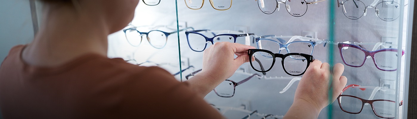 Patient select a pair of Calvin Klein frames at the Commonwealth location of NECO Center for Eye Care