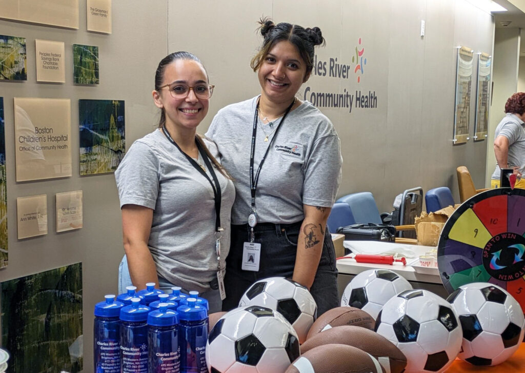 Staff at Charles River Community Healh with soccer balls